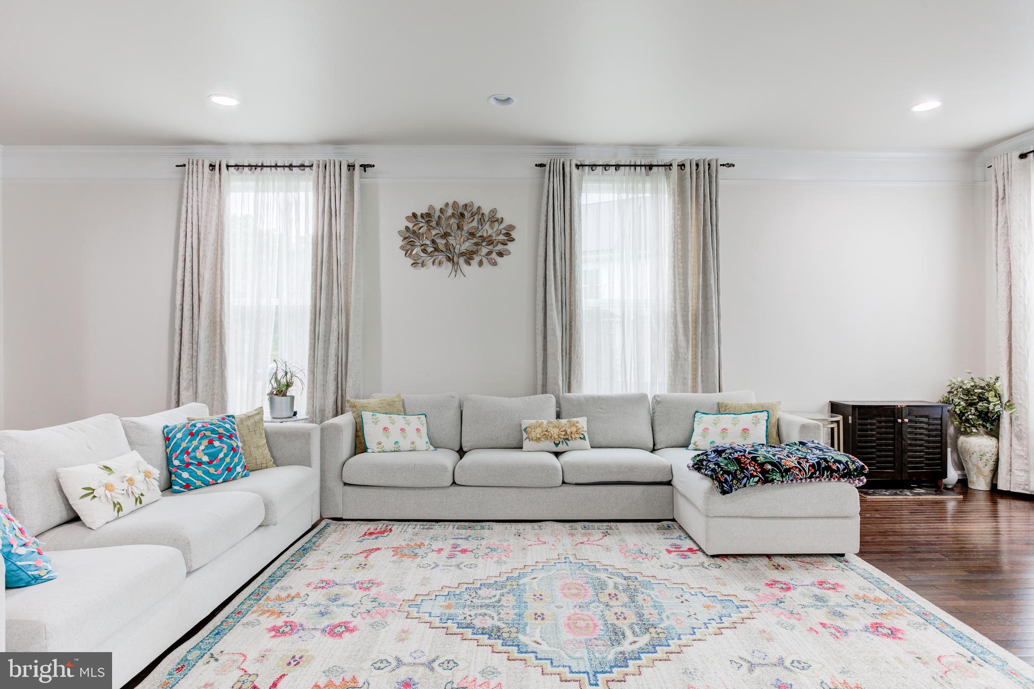 22800 Bubbling Brook Drive Brambleton, VA 20148 - Photo 19 of 64 a living room with furniture and a large window