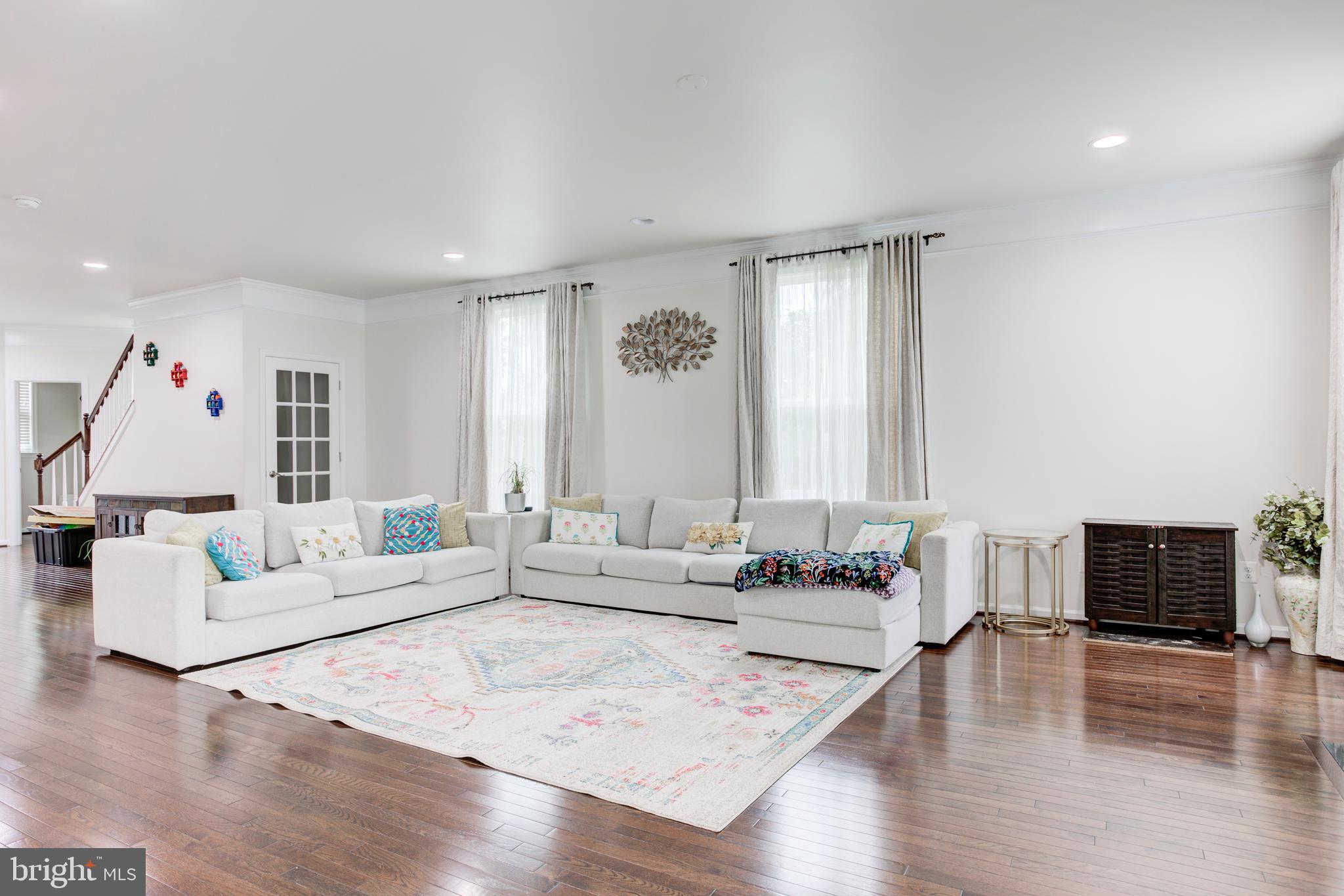 22800 Bubbling Brook Drive Brambleton, VA 20148 - Photo 20 of 64 a living room with furniture and wooden floor