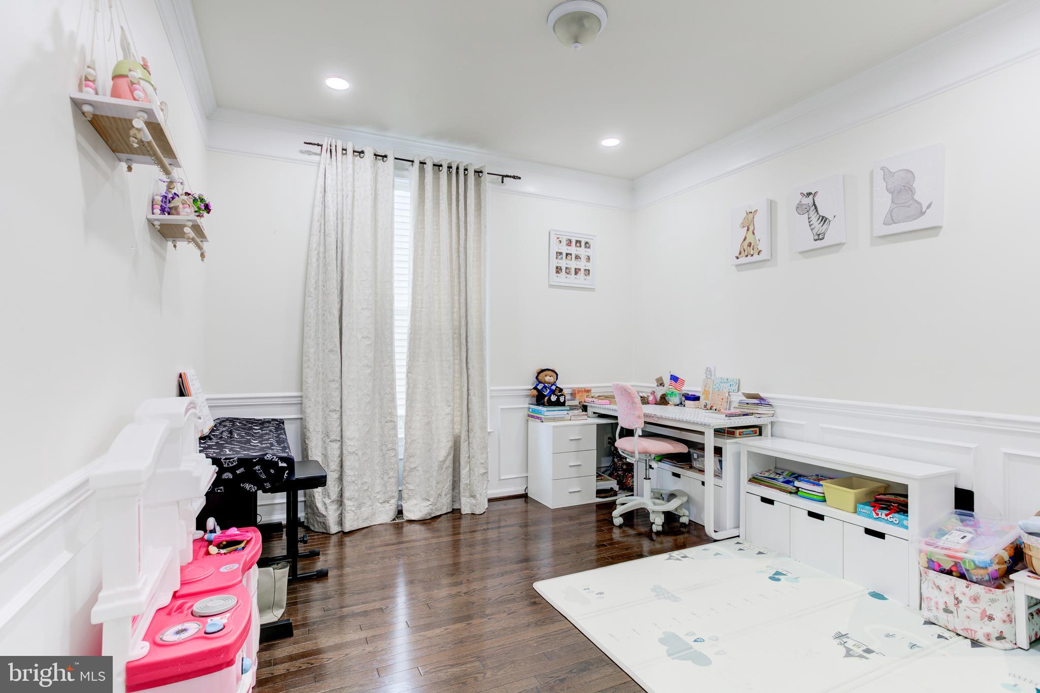 22800 Bubbling Brook Drive Brambleton, VA 20148 - Photo 29 of 64 a room with toys and wooden floor