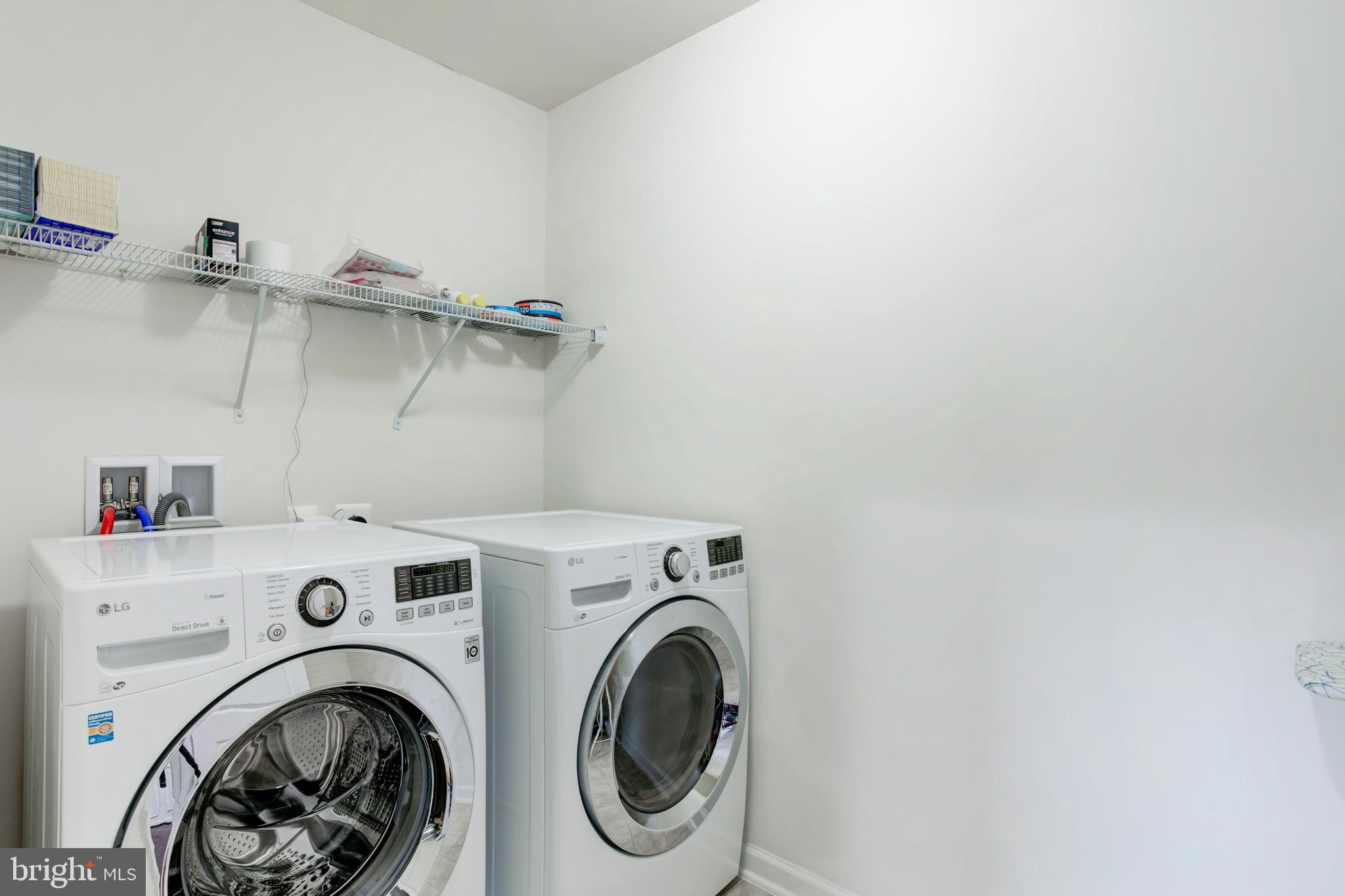 22800 Bubbling Brook Drive Brambleton, VA 20148 - Photo 37 of 64 a view of storage and utility room with washer and dryer