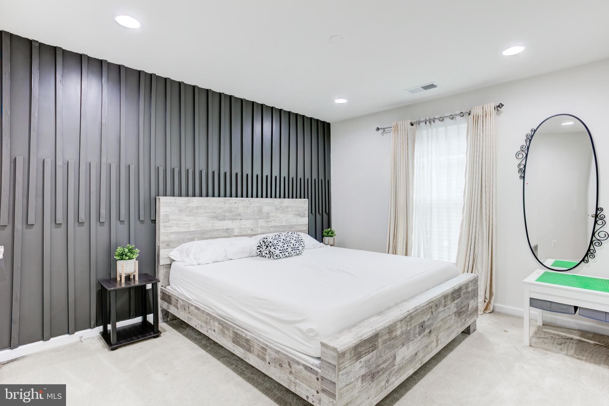 22800 Bubbling Brook Drive Brambleton, VA 20148 - Photo 38 of 64 a bed sitting in a spacious bedroom next to a window