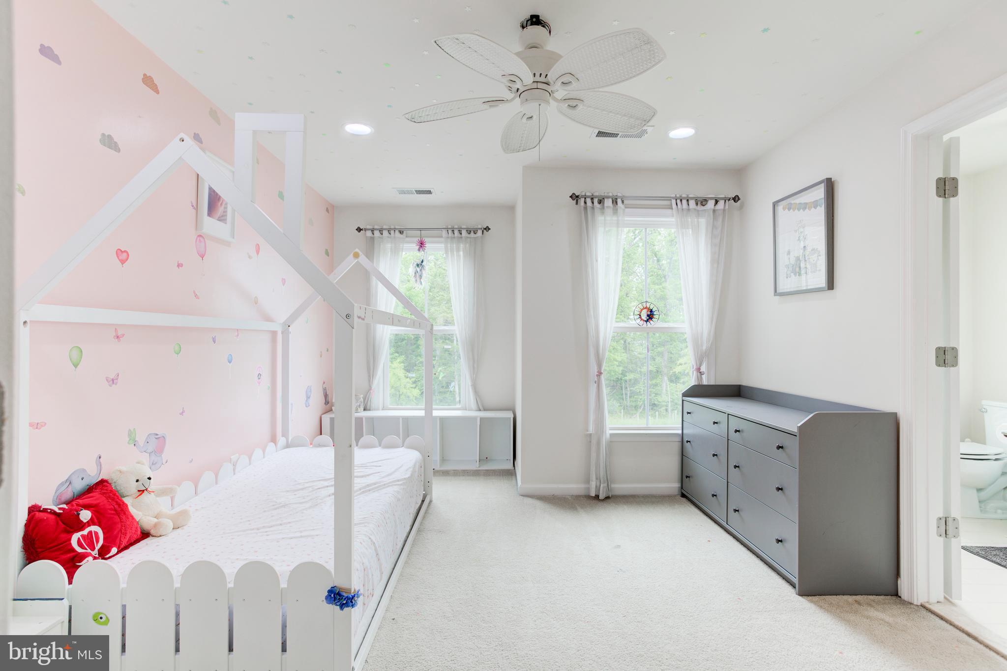 22800 Bubbling Brook Drive Brambleton, VA 20148 - Photo 43 of 64 a living room with furniture and a chandelier
