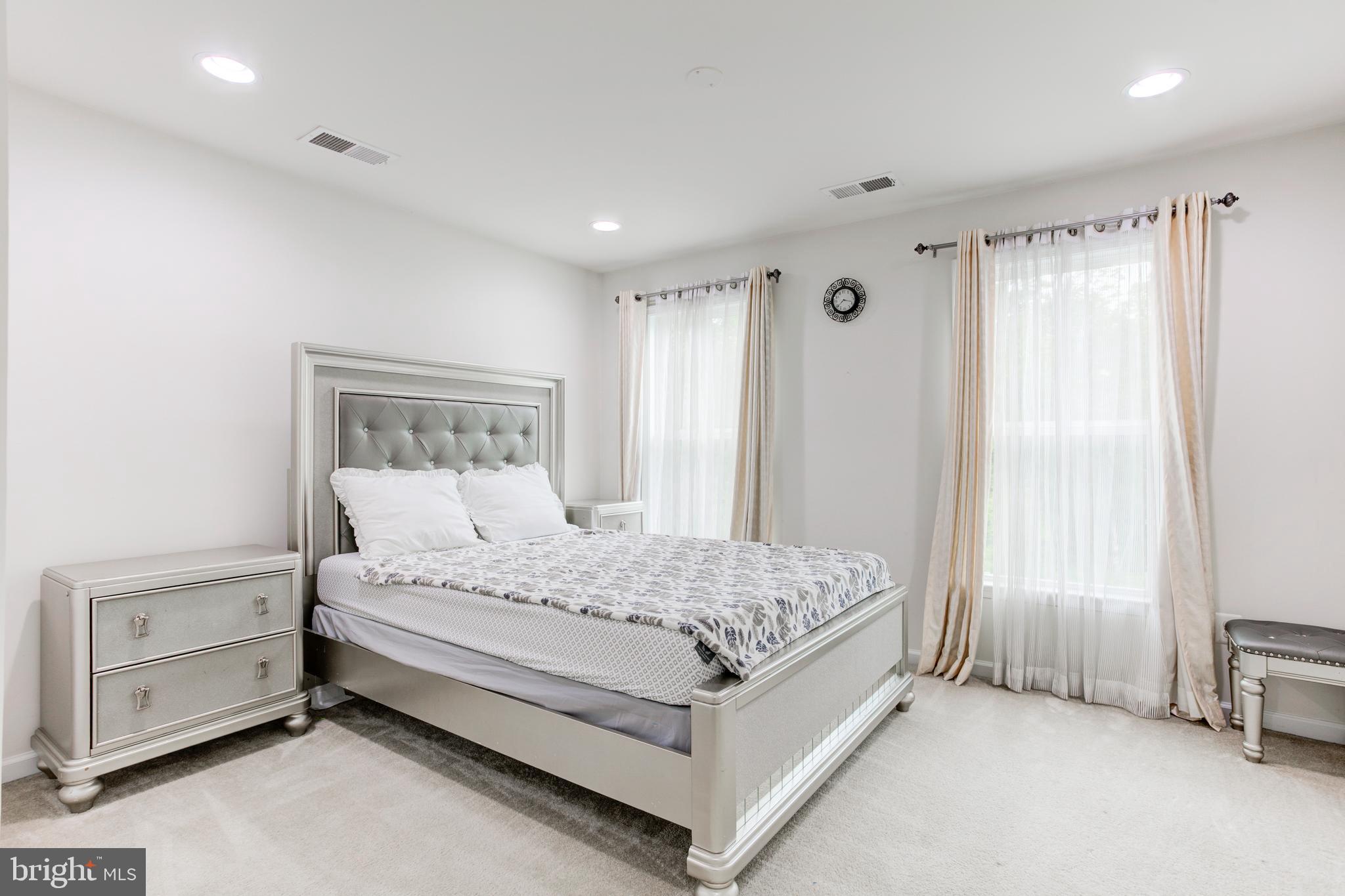 22800 Bubbling Brook Drive Brambleton, VA 20148 - Photo 47 of 64 a bedroom with a bed and a window