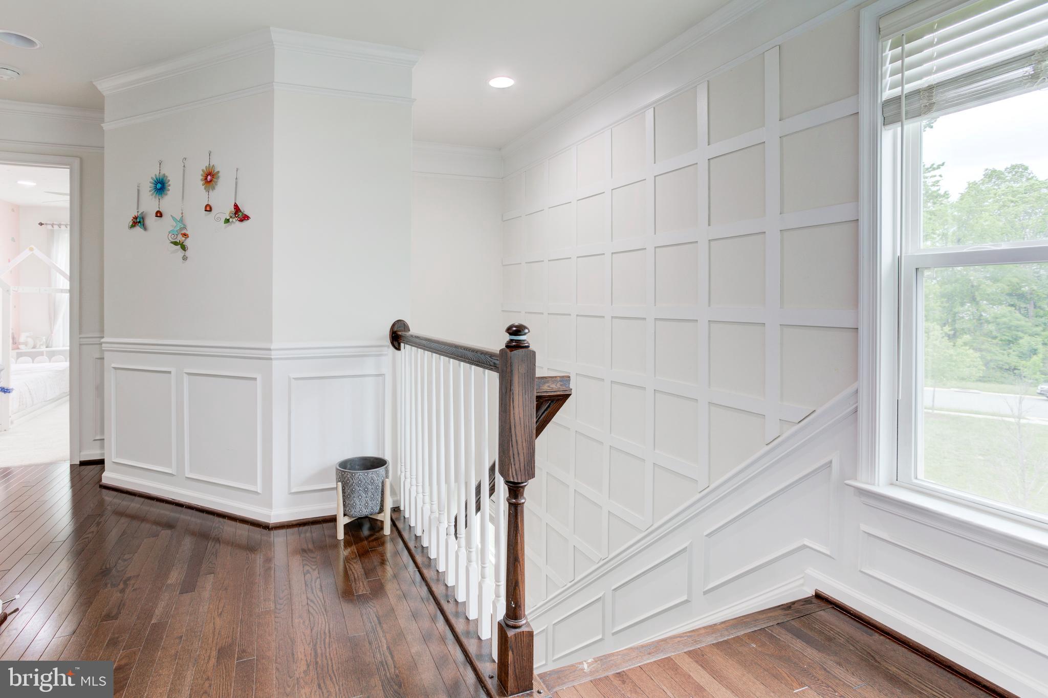 22800 Bubbling Brook Drive Brambleton, VA 20148 - Photo 49 of 64 a view of entryway with wooden floor and stairs