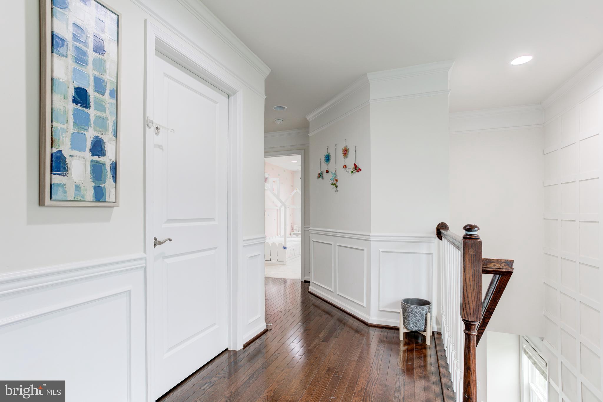 22800 Bubbling Brook Drive Brambleton, VA 20148 - Photo 50 of 64 a view of a hallway with wooden floor and closet