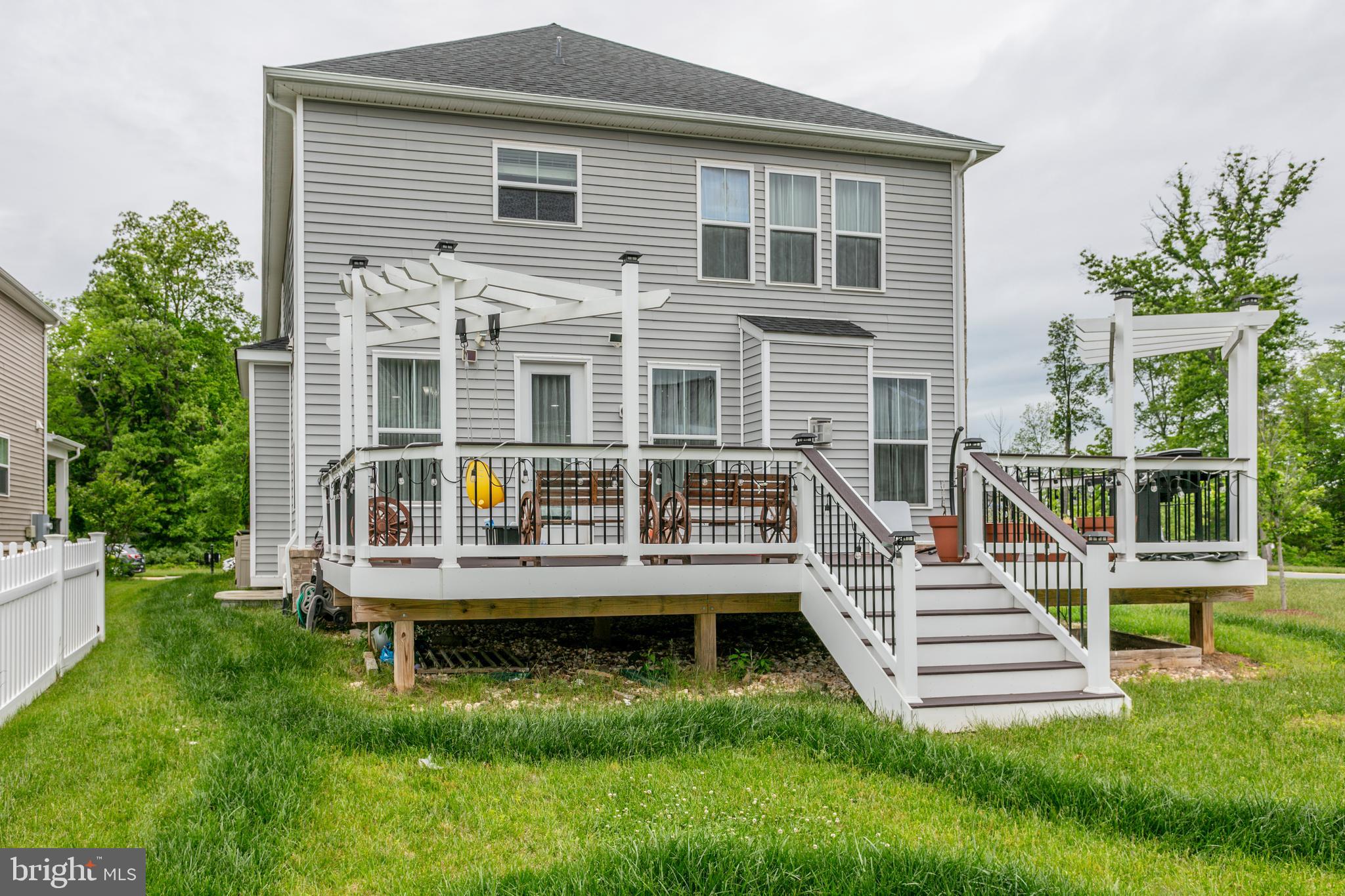 22800 Bubbling Brook Drive Brambleton, VA 20148 - Photo 62 of 64 a view of a house with a yard and sitting area