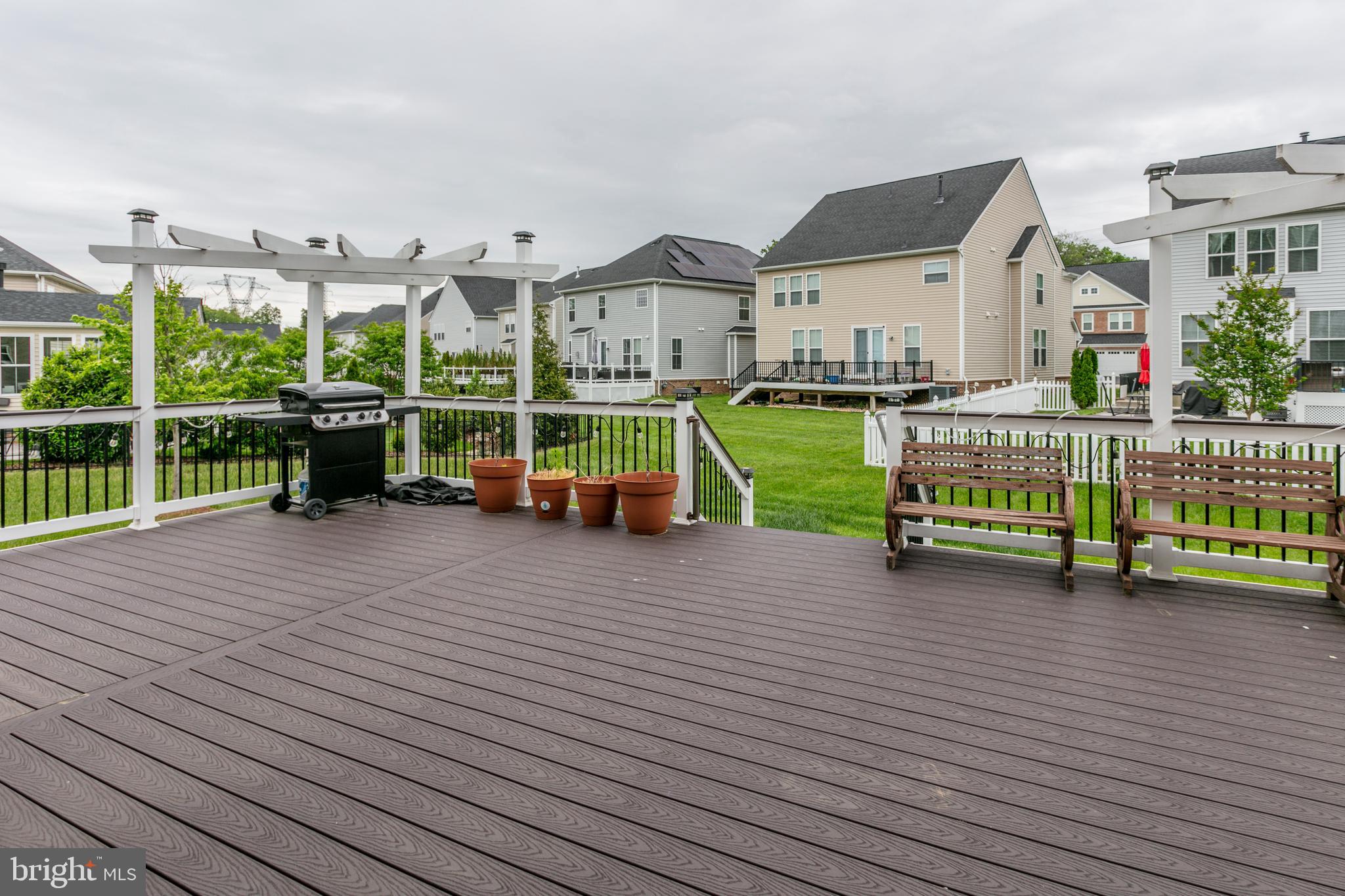 22800 Bubbling Brook Drive Brambleton, VA 20148 - Photo 9 of 64 an outdoor view of a house with wooden floor and outdoor space