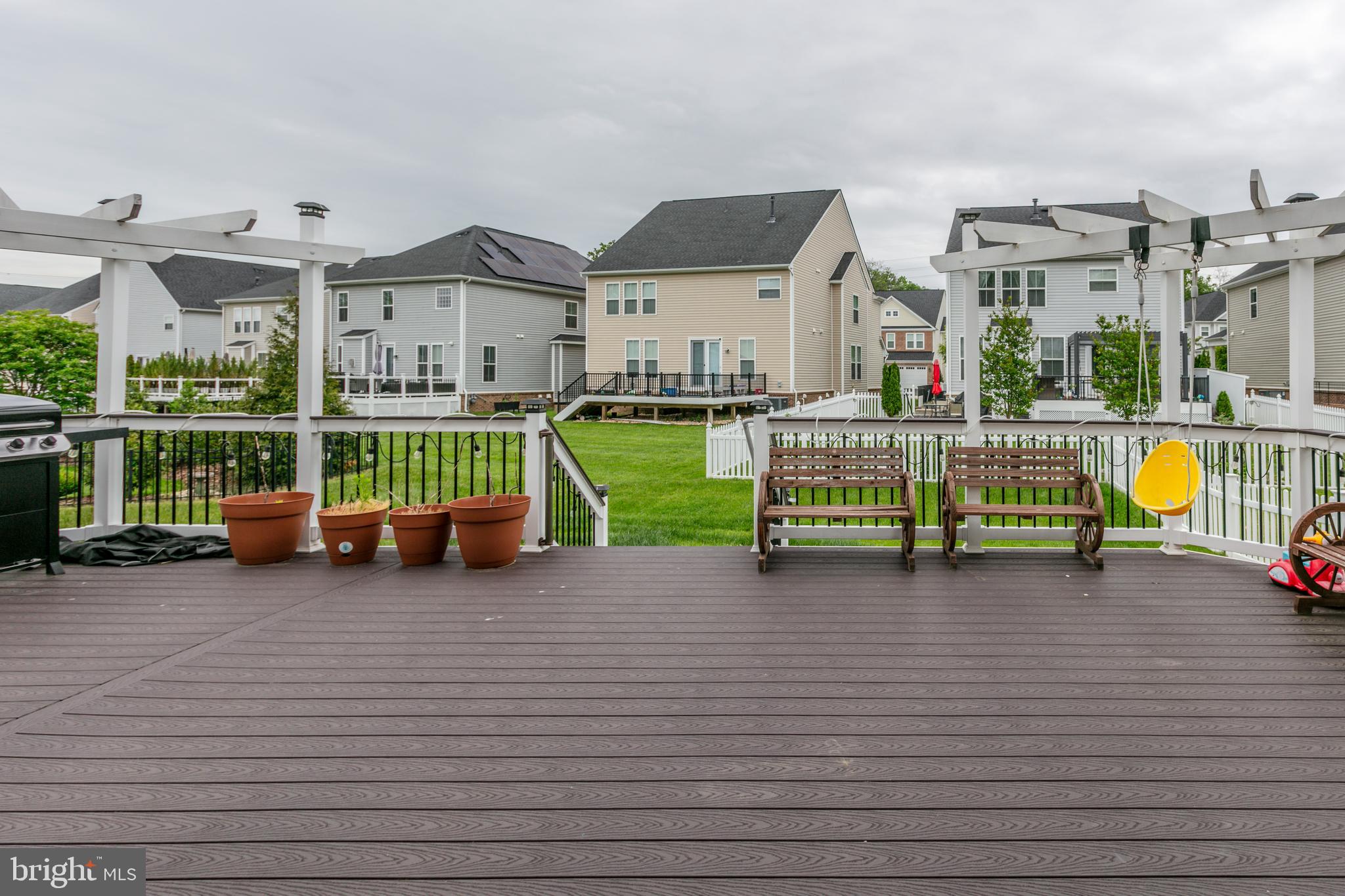 22800 Bubbling Brook Drive Brambleton, VA 20148 - Photo 10 of 64 a view of a house with a swimming pool and sitting area
