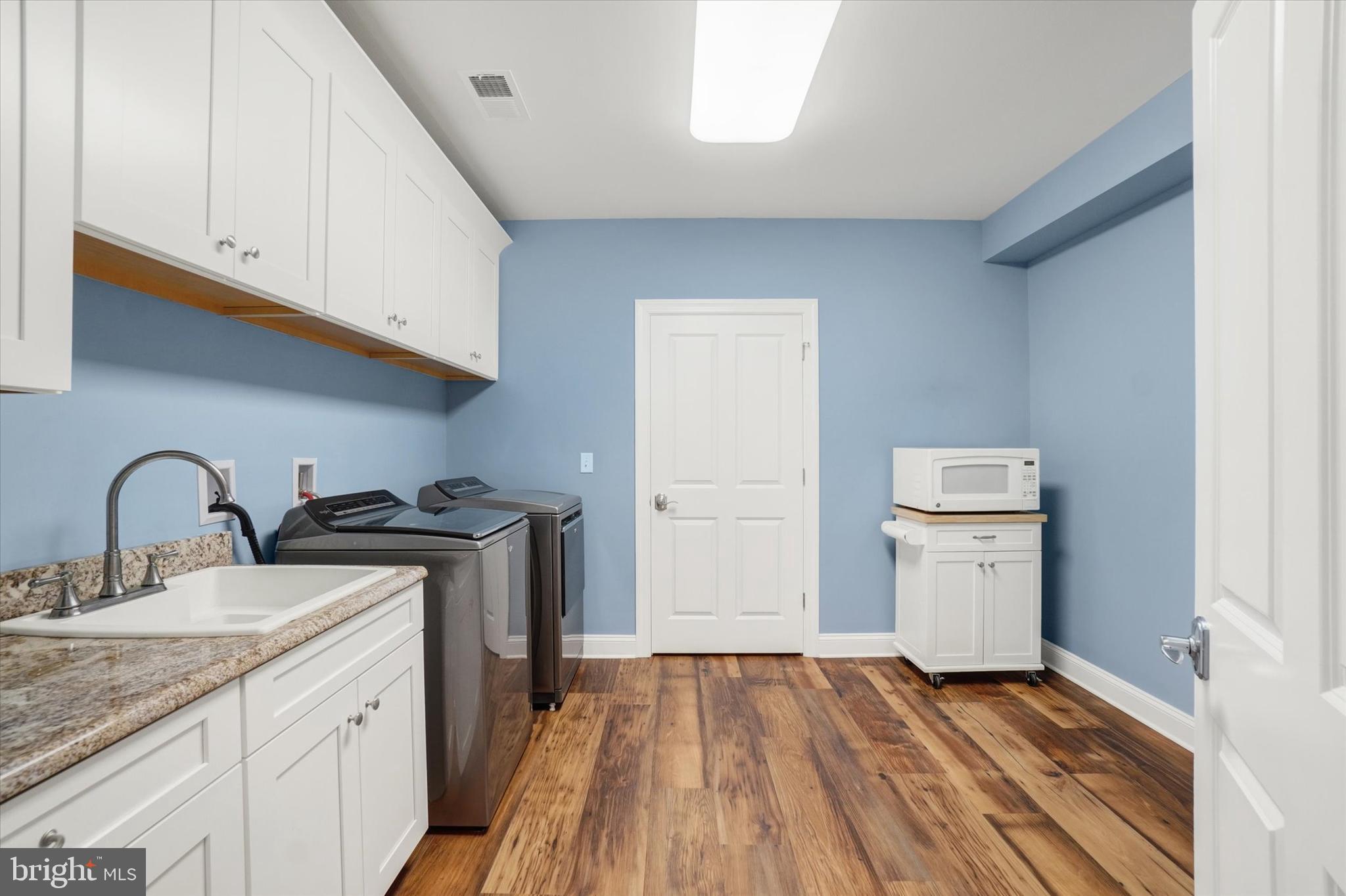 3833 Pleasant Valley Road York, PA 17406 - Photo 41 of 66 Large laundry room with prep area, cabinets & sink