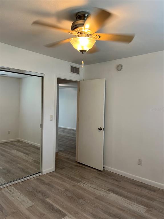3160 Highlands Boulevard, Unit 3160 Palm Harbor, FL 34684 - Photo 19 of 40 a view of a chandelier fan and entryway