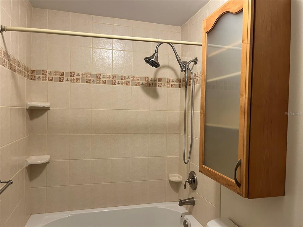 3160 Highlands Boulevard, Unit 3160 Palm Harbor, FL 34684 - Photo 21 of 40 a bathroom with a shower