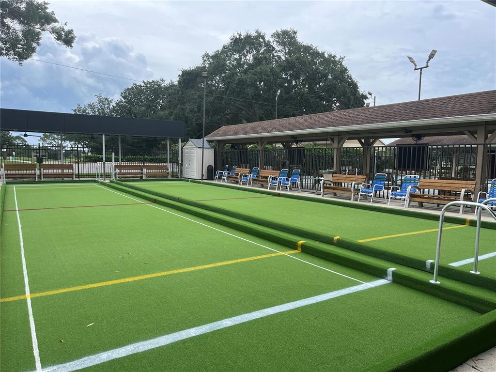 3160 Highlands Boulevard, Unit 3160 Palm Harbor, FL 34684 - Photo 28 of 40 a view of a tennis ground with large trees