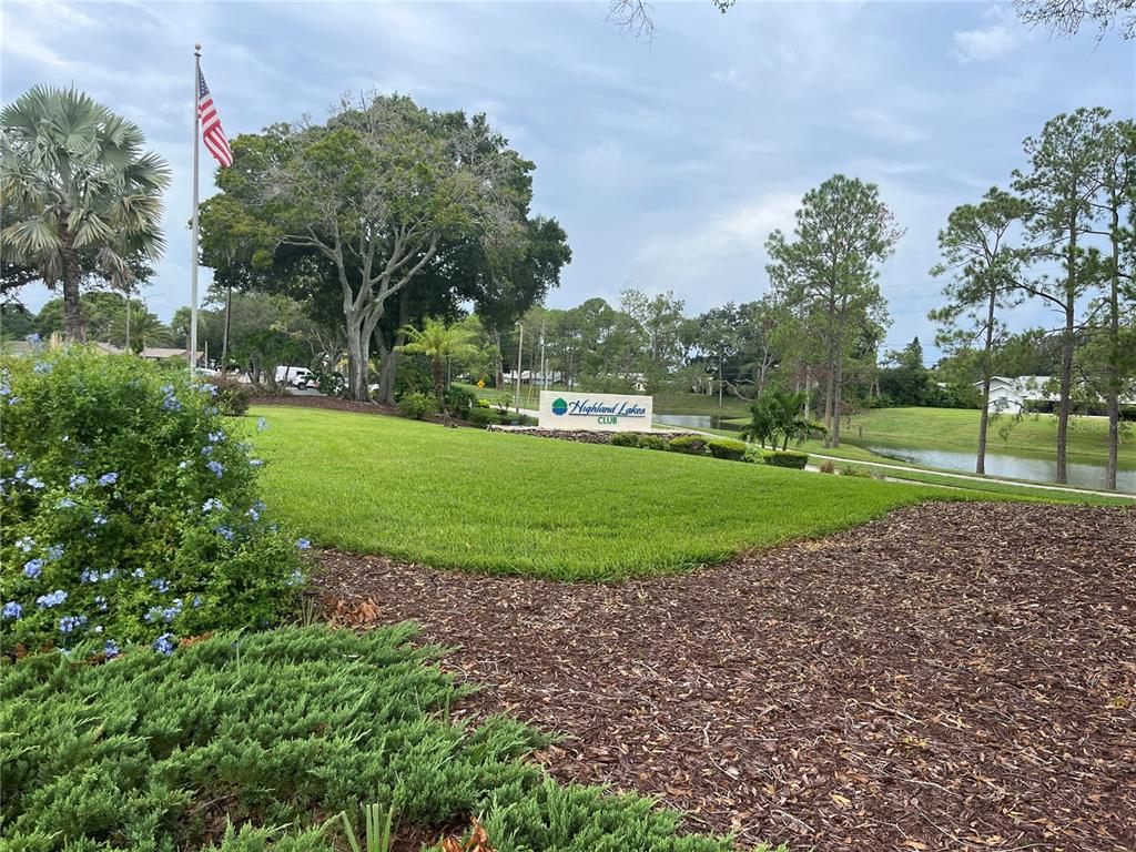 3160 Highlands Boulevard, Unit 3160 Palm Harbor, FL 34684 - Photo 33 of 40 a view of a golf course with a garden