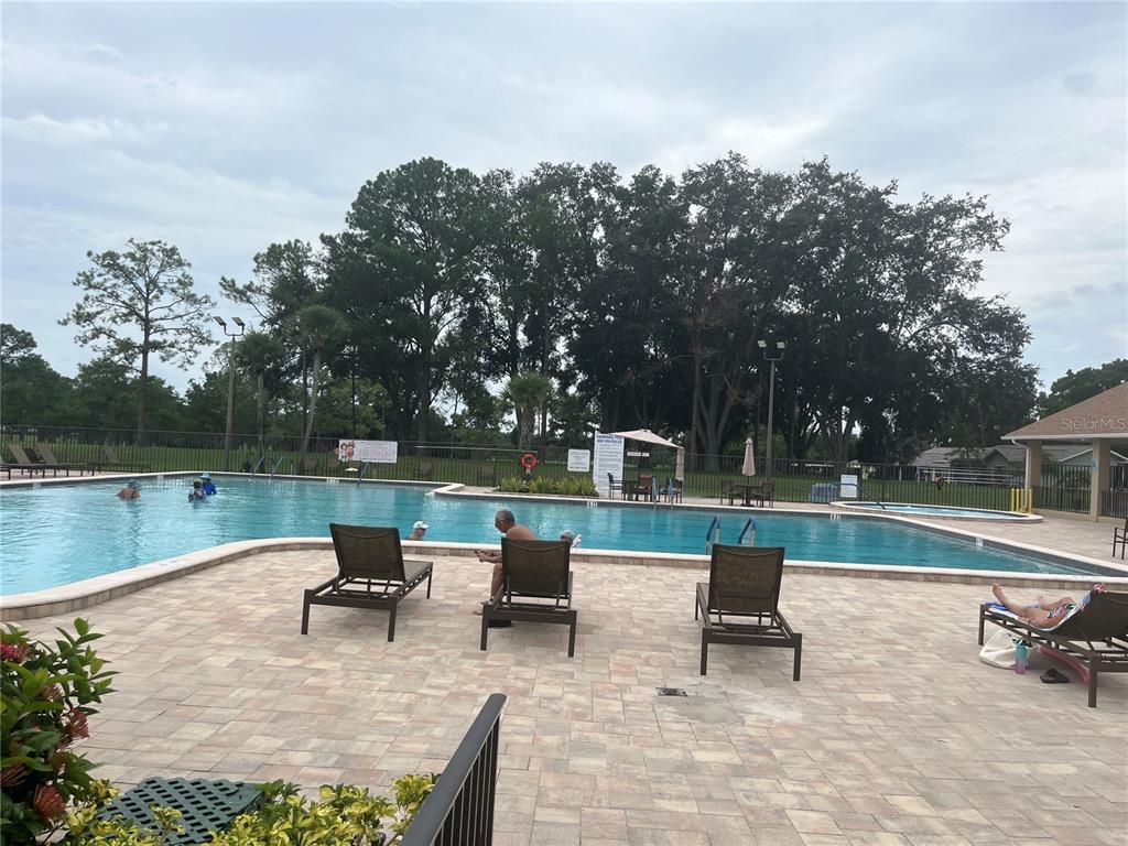 3160 Highlands Boulevard, Unit 3160 Palm Harbor, FL 34684 - Photo 38 of 40 a view of a terrace with sitting area