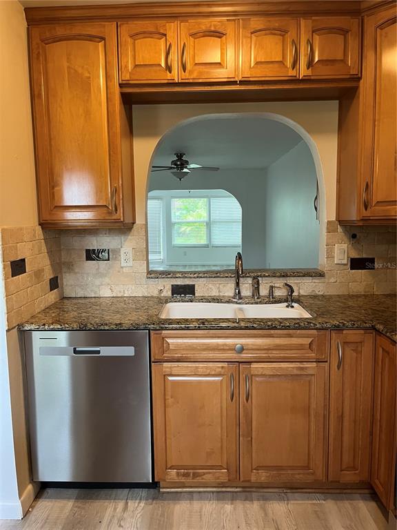 3160 Highlands Boulevard, Unit 3160 Palm Harbor, FL 34684 - Photo 6 of 40 a kitchen with a sink and cabinets