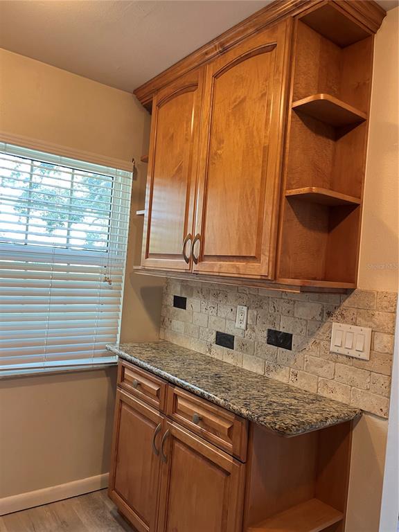 3160 Highlands Boulevard, Unit 3160 Palm Harbor, FL 34684 - Photo 7 of 40 a kitchen with a sink and a window
