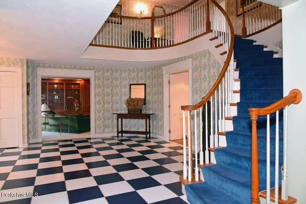 a bedroom with two beds and a window