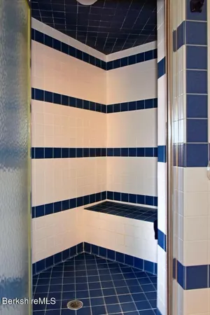 a bedroom with two beds and a window