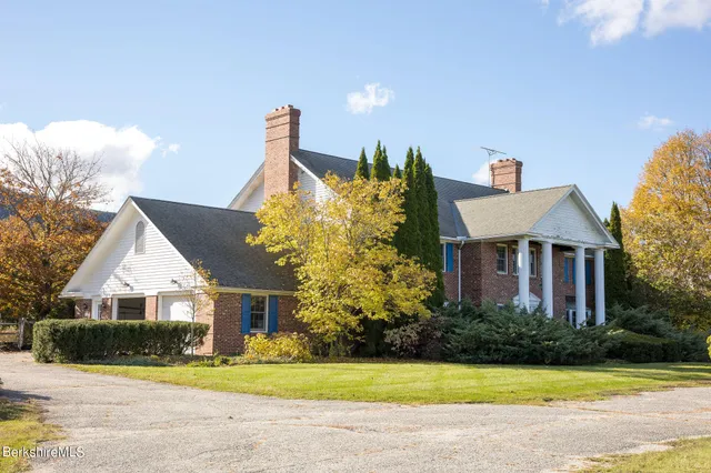 a view of a swimming pool with a yard