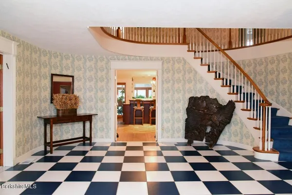 a kitchen with stainless steel appliances granite countertop a stove and a refrigerator