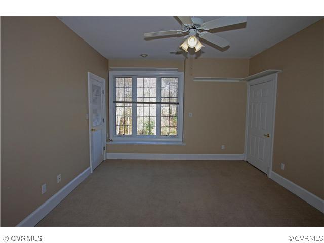 14131 River Road Chesterfield, VA 23838 - Photo 15 of 24 a view of an empty room with a ceiling fan