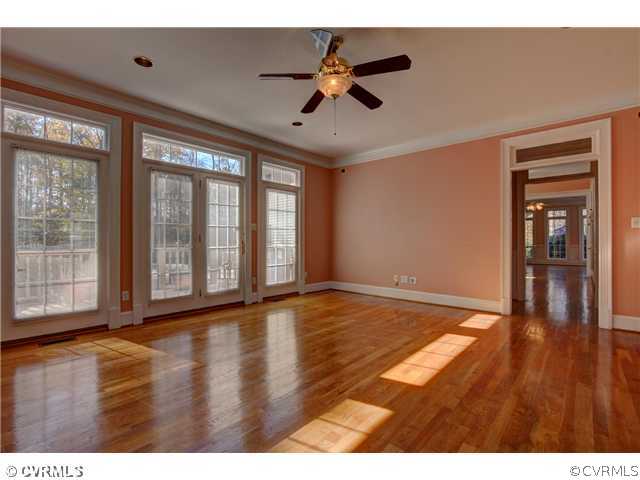 14131 River Road Chesterfield, VA 23838 - Photo 6 of 24 a view of an empty room with window and wooden floor