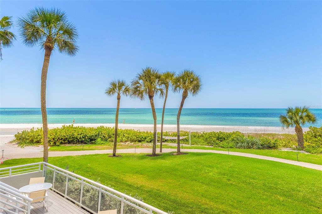 240 Sands Point Road, Unit 4104 Longboat Key, FL 34228 - Photo 26 of 47 a view of a garden and swimming pool