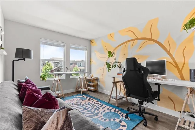 a living room with furniture and a window