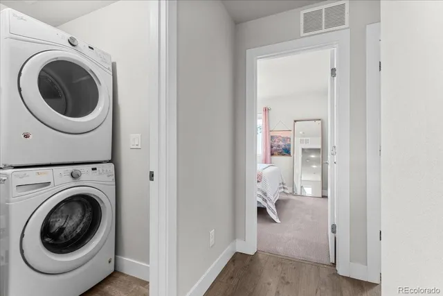 a view of a hallway with washer and dryer