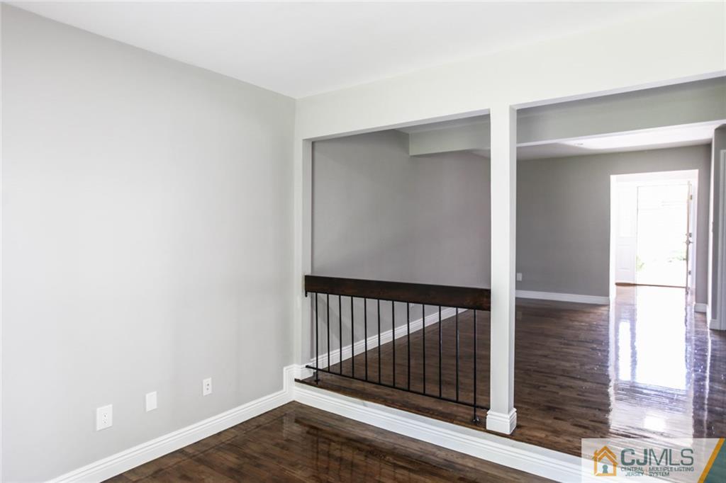 4003 Hana Road Edison, NJ 08817 - Photo 6 of 17 a view of a room with wooden floor and windows