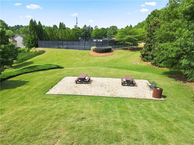 a view of a fountain and a yard