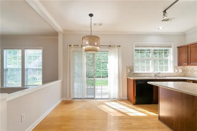 a open kitchen with granite countertop a stove and a sink
