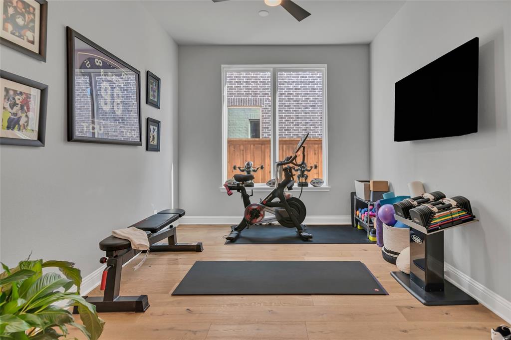 13753 Green Elm Road Fort Worth, TX 76008 - Photo 11 of 40 Workout room as currently used has sliding barn doors. Could also be used as an office or dining room!