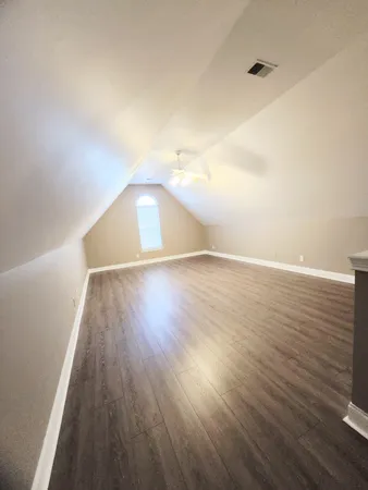 a view of a livingroom with wooden floor