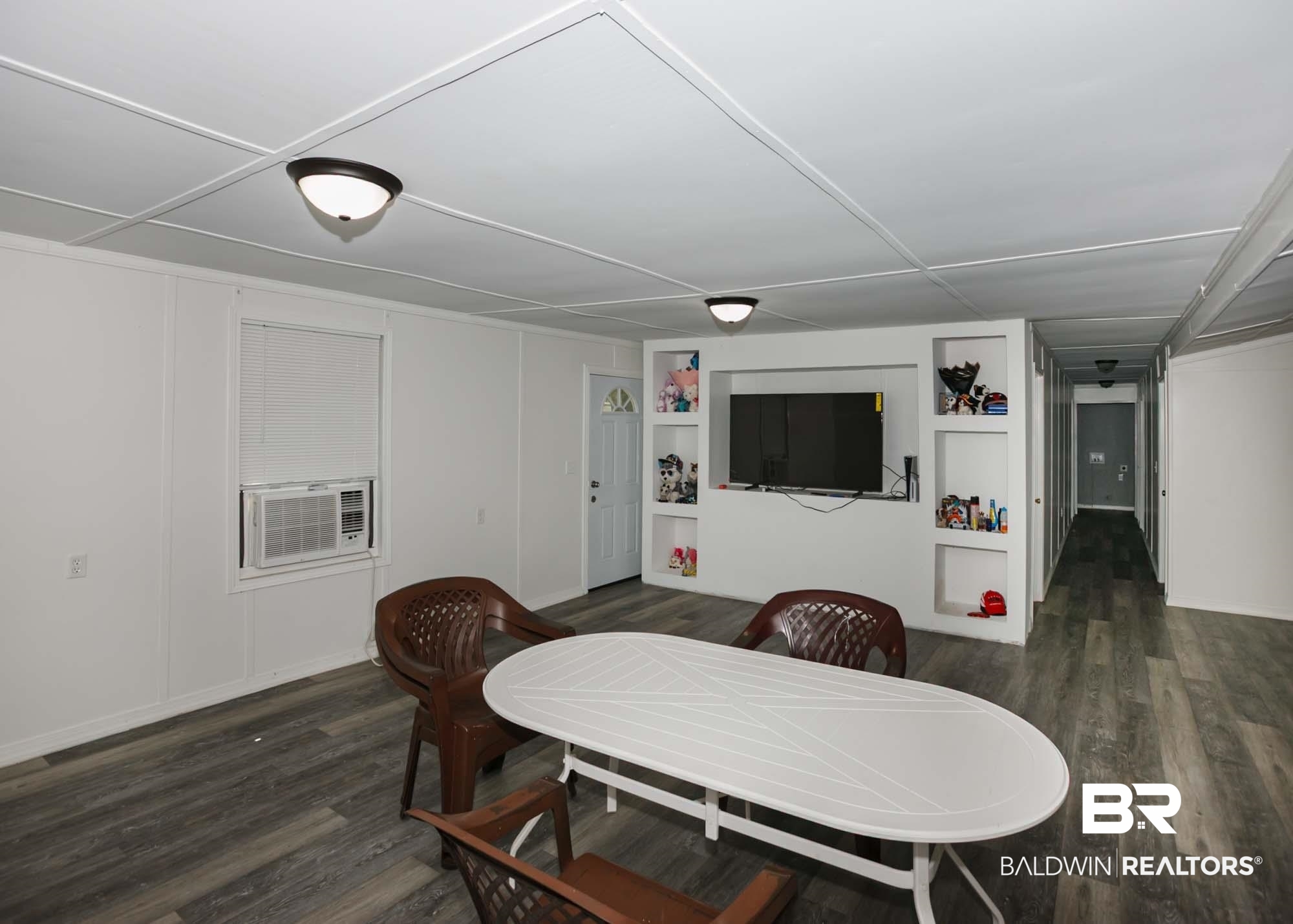 11998 Workman Avenue Foley, AL 36535 - Photo 14 of 59 Dining room with built in features and wood finished floors