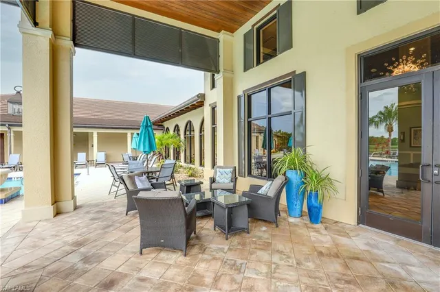 a living room with lots of furniture and a chandelier