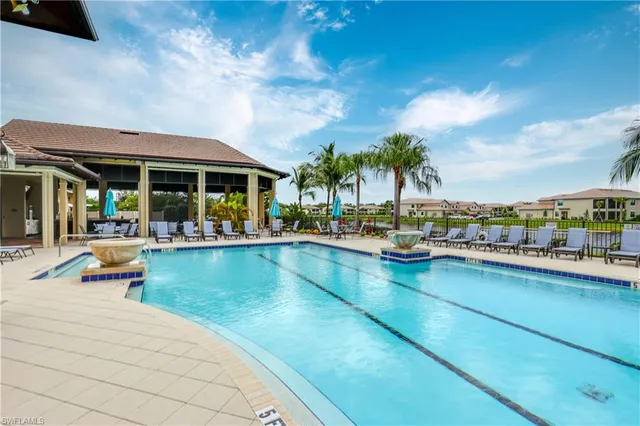 a view of swimming pool with outdoor seating and outdoor kitchen