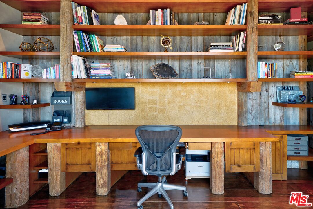 3020 Corral Canyon Road Malibu, CA 90265 - Photo 13 of 29 a view of a workspace with furniture and wooden floor