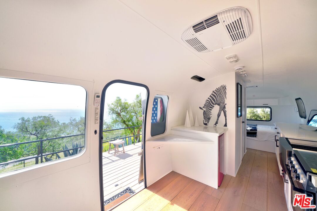 3020 Corral Canyon Road Malibu, CA 90265 - Photo 27 of 29 a view of living room with furniture and a mirror