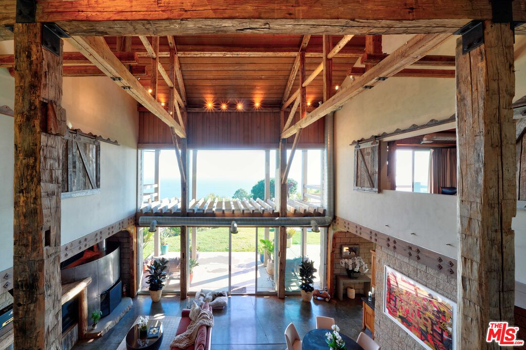 3020 Corral Canyon Road Malibu, CA 90265 - Photo 3 of 29 a view of entryway with hardwood floor and a ceiling fan