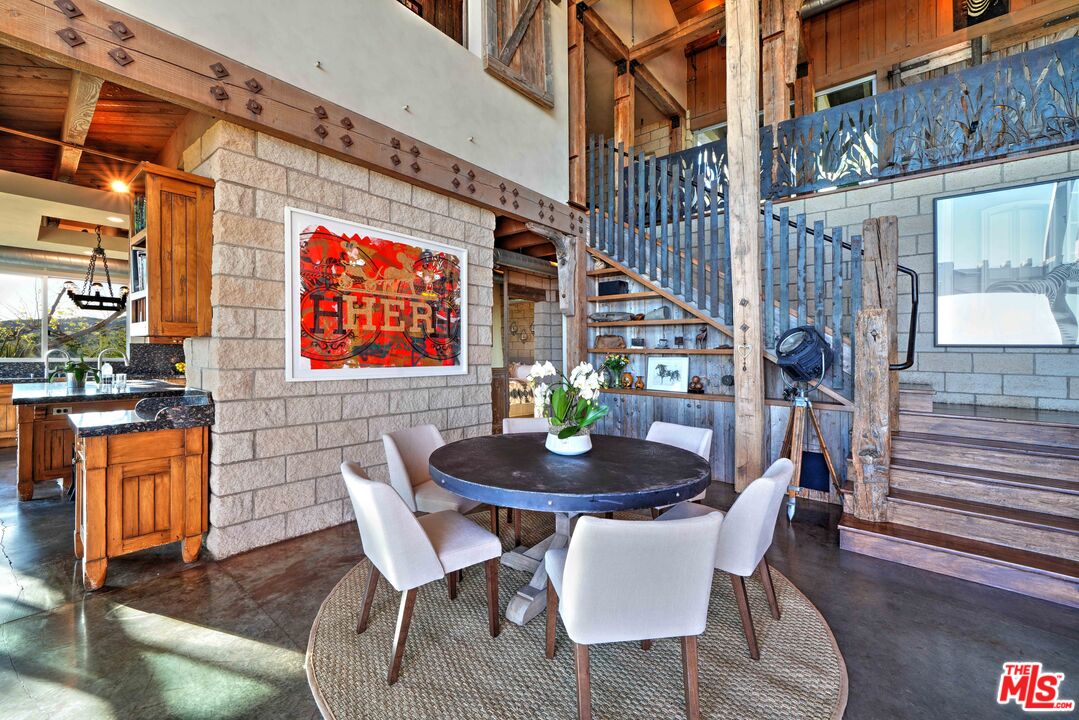 3020 Corral Canyon Road Malibu, CA 90265 - Photo 5 of 29 a outdoor dining space with furniture and wooden floor