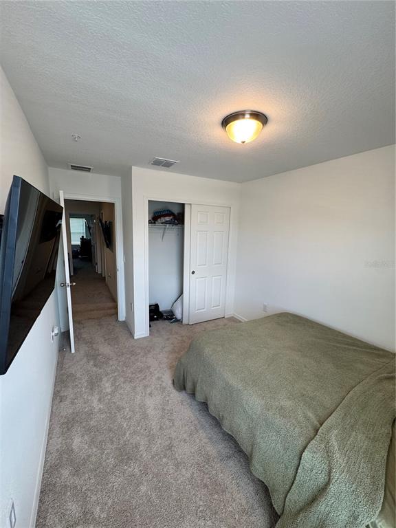 2089 Crape Jasmine Lane Orlando, FL 32824 - Photo 15 of 22 a view of a livingroom with a staircase