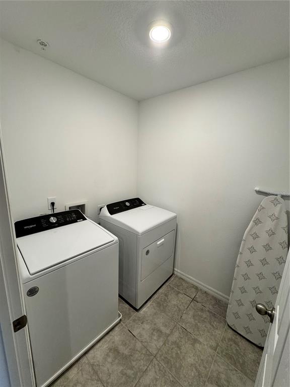 2089 Crape Jasmine Lane Orlando, FL 32824 - Photo 17 of 22 a utility room with dryer and washer