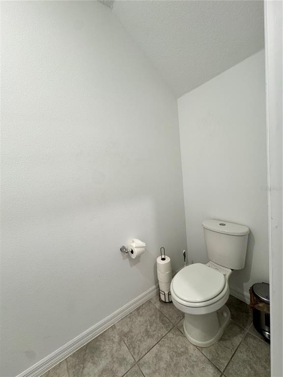 2089 Crape Jasmine Lane Orlando, FL 32824 - Photo 5 of 22 a white toilet sitting next to a white sink