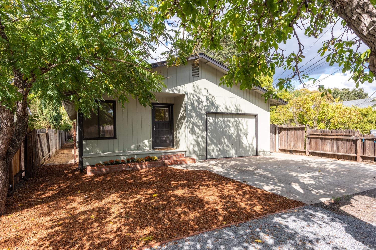 511 Hewett Street Santa Rosa, CA 95401 - Photo 1 of 1 a front view of a house with a yard and garage