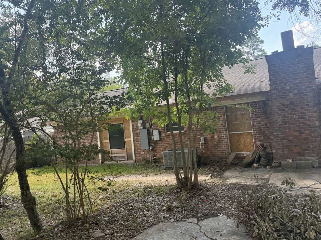 2509 River Ridge Conroe, TX 77385 - Photo 2 of 11 a view of a house with a yard