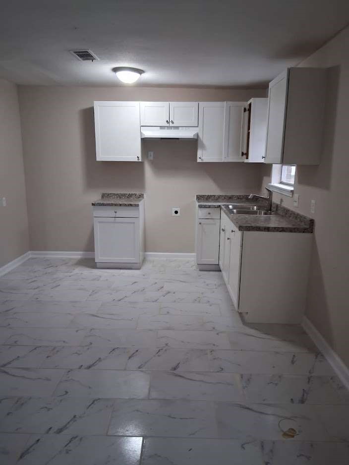 2509 River Ridge Conroe, TX 77385 - Photo 6 of 11 a kitchen with stainless steel appliances granite countertop a stove a sink and a refrigerator