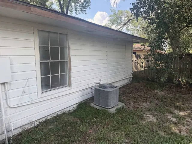 a potted plant sitting in front of a house