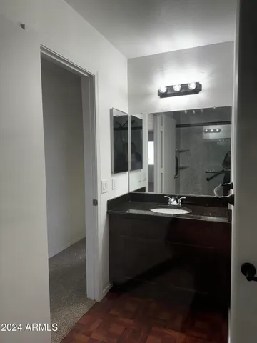 a bathroom with a shower and toilet