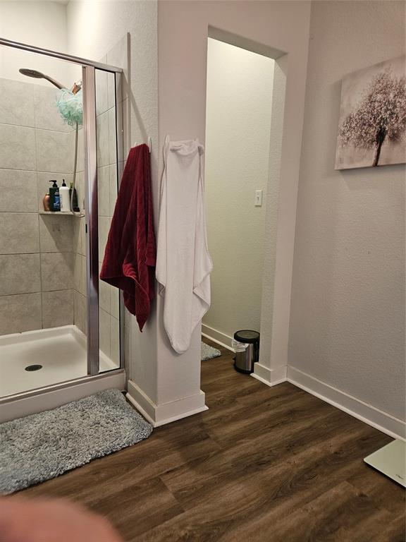 312 Gidran Trail Georgetown, TX 78626 - Photo 11 of 14 Walk-in shower with clear glass enclosure and tiled walls